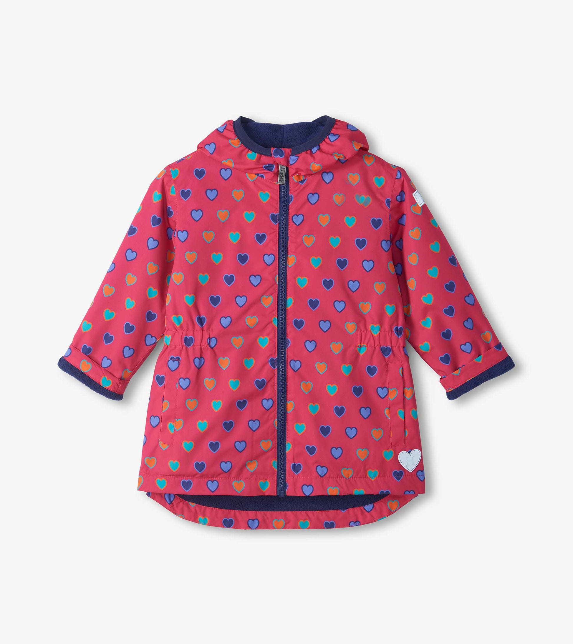 Front view of pink kids field jacket with blue, teal, and orange heart print, hood, zipper, and side pockets