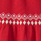 Red fabric with a white geometric diamond pattern across the center