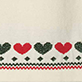 Row of hearts in red, green, and gray above a red and green patterned border