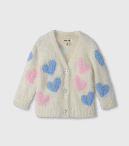 Front view of cream fuzzy cardigan with oversized pink and blue hearts and glitter buttons