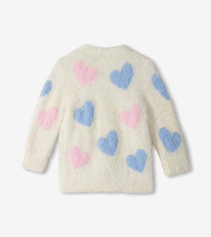 Back view of cream fuzzy cardigan with oversized pink and blue heart pattern