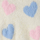 Blue and pink heart pattern on a cream textured background