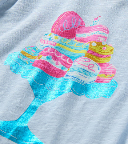 Close-up of colorful macaron graphic on a shiny blue cake stand