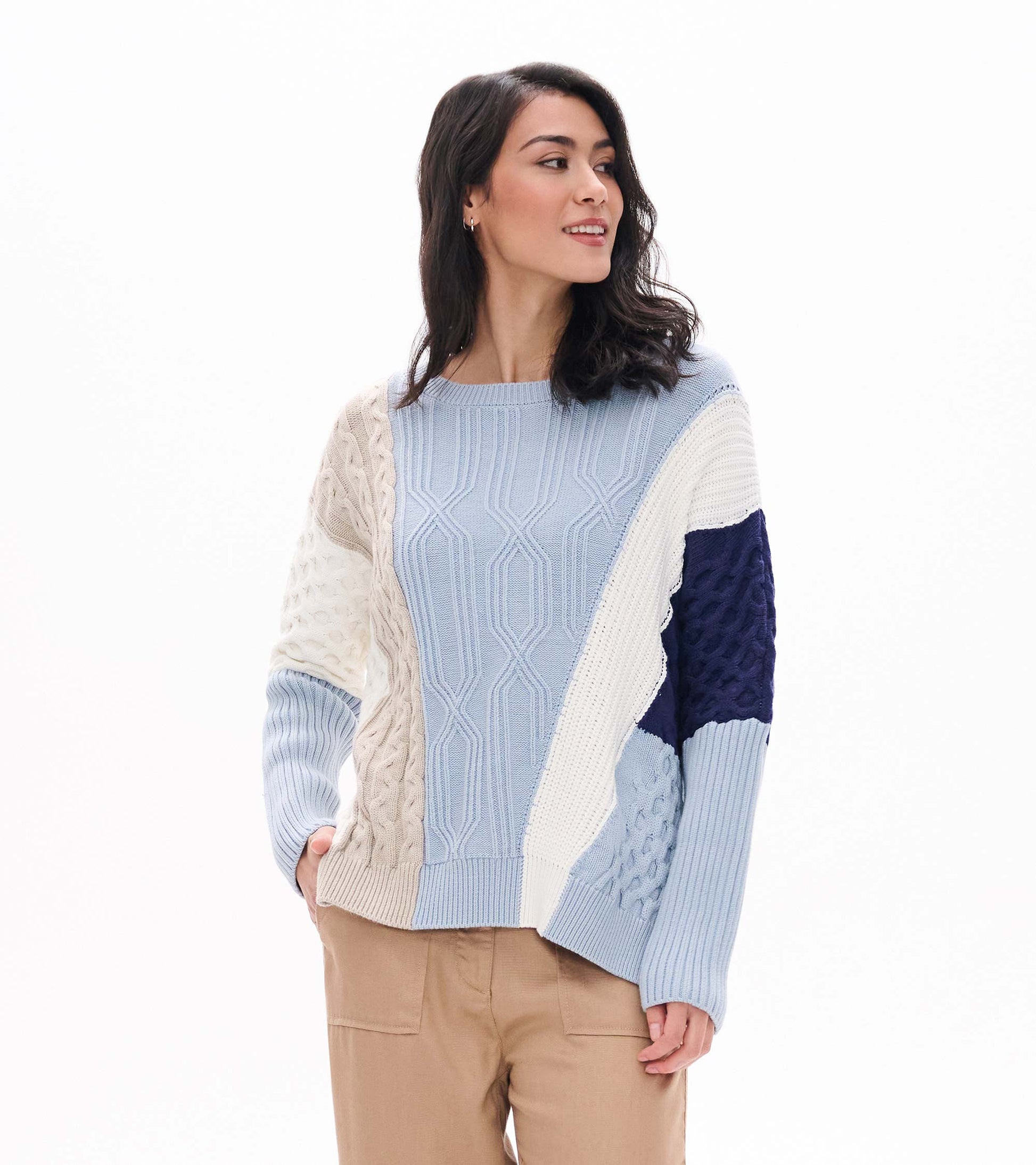 Front view of Kentucky Blue mixed pattern sweater with light blue, cream, beige, and navy knit panels