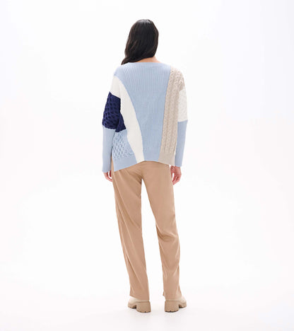 Back view of Kentucky Blue mixed pattern sweater with light blue, cream, beige, and navy knit panels