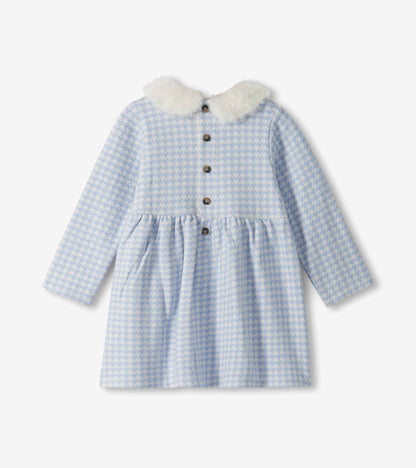 Back view of blue and white houndstooth long-sleeve dress with white fluffy collar and button placket