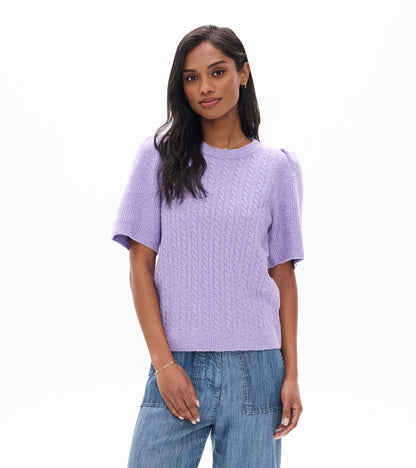 Front view of lilac cable knit sweater with short puff sleeves and ribbed crew neckline