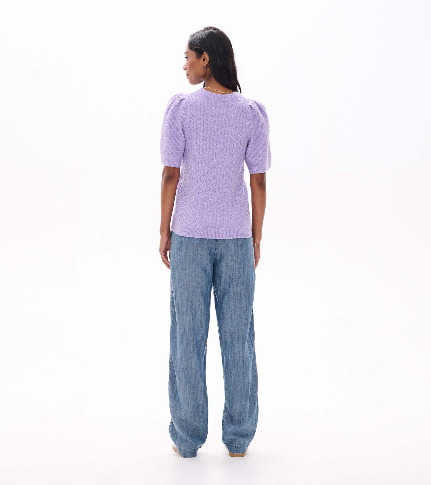 Back view of lilac cable knit sweater with short puff sleeves and ribbed hem