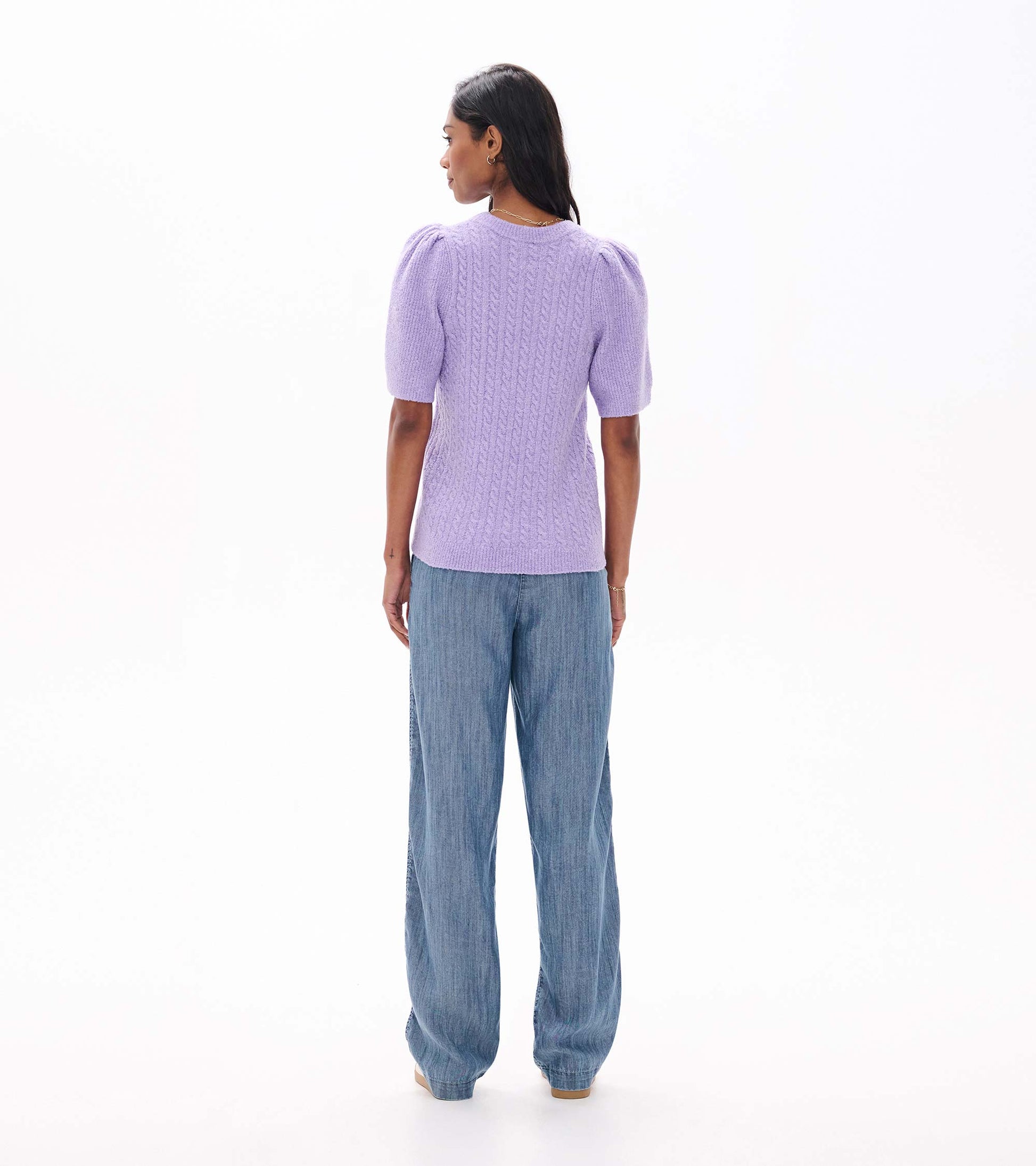 Back view of lilac cable knit sweater with short puff sleeves and ribbed hem