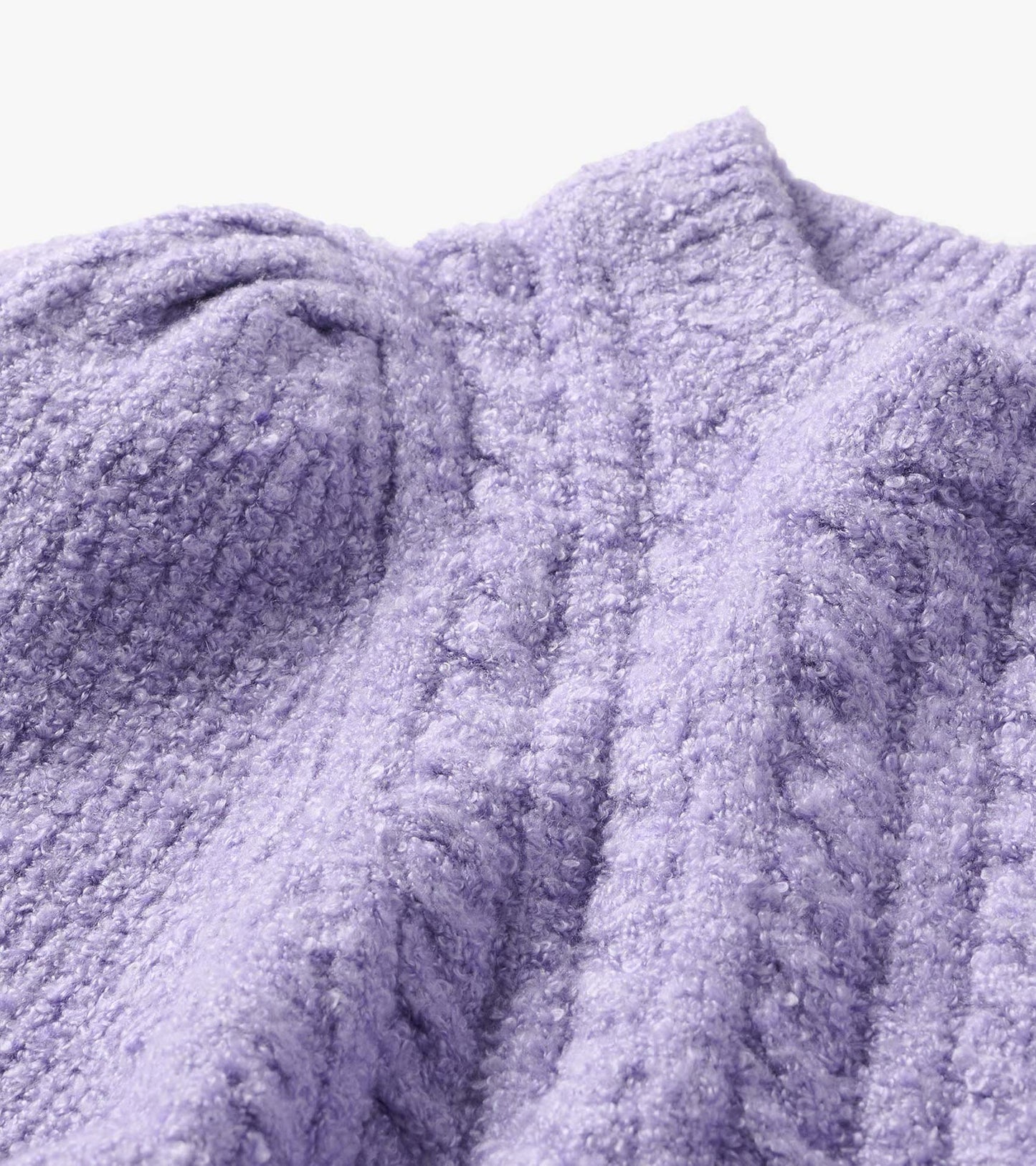 Close-up of Emerson sweater in lilac boucle with textured knit and ribbed mock neckline