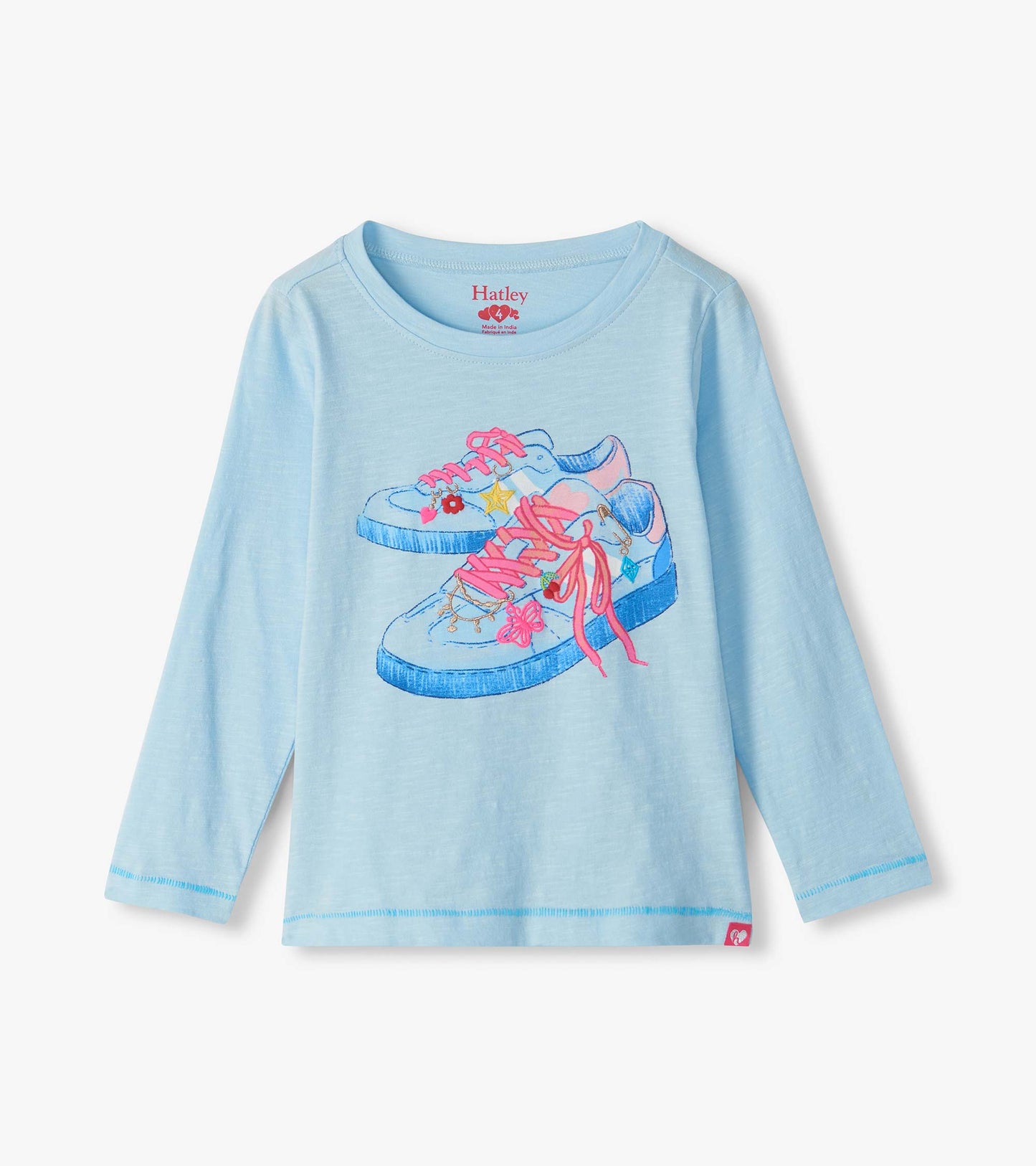 Light blue long sleeve tee with sneaker graphic in blue and pink on the front