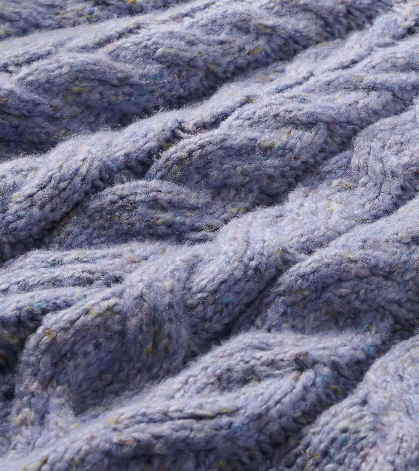 Close-up of the lilac speckled cable-knit texture with multicolor flecks