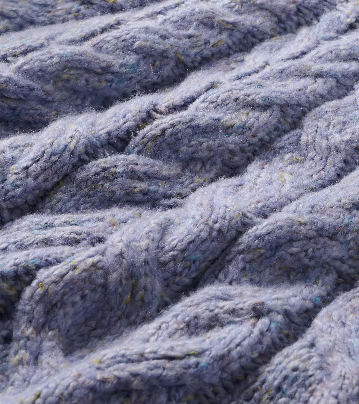 Close-up of the lilac speckled cable-knit texture with multicolor flecks