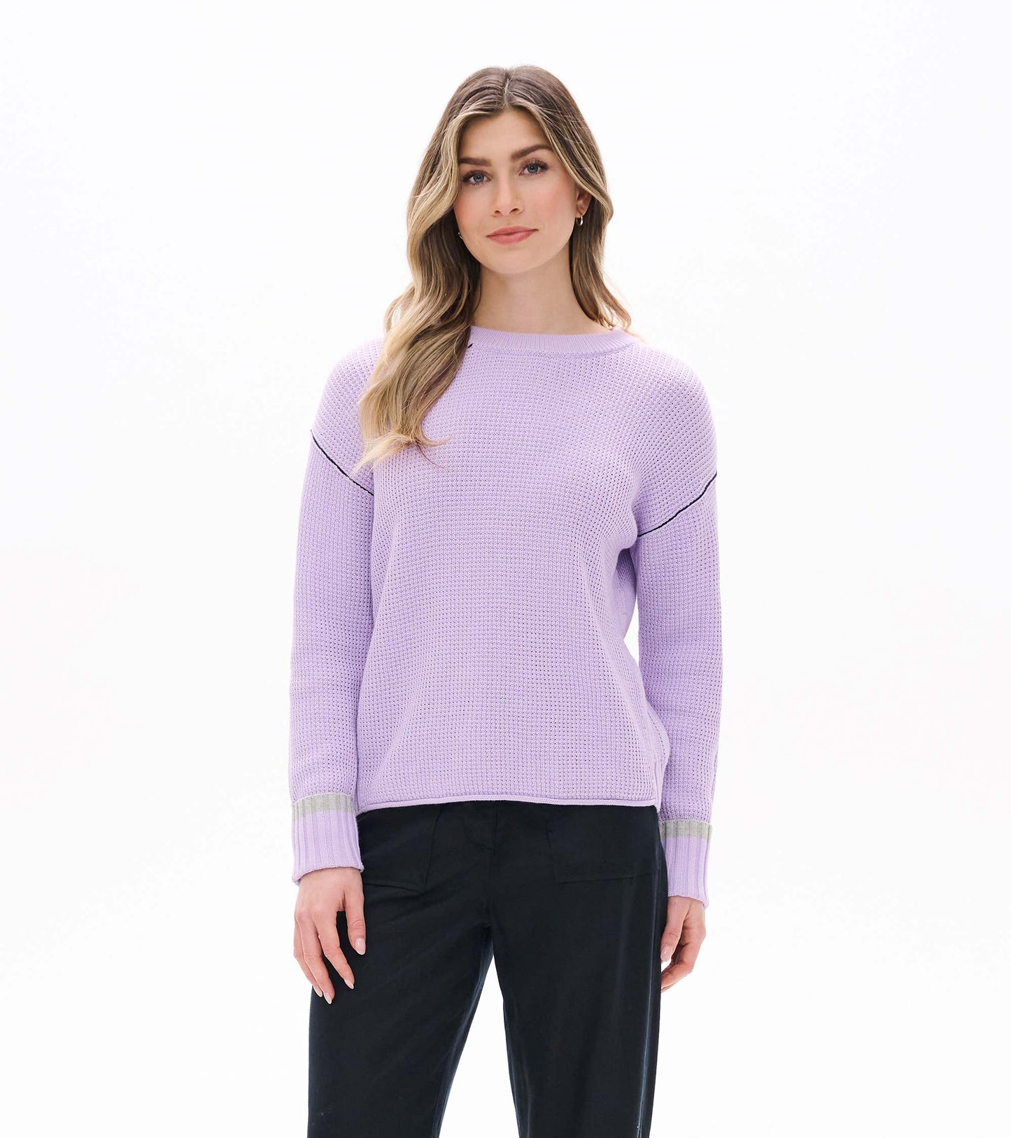 Front view of lilac waffle knit sweater with crew neck, drop shoulders, and ribbed cuffs with gray stripe