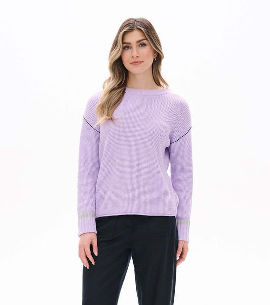 Front view of lilac waffle knit sweater with crew neck, drop shoulders, and ribbed cuffs with gray stripe