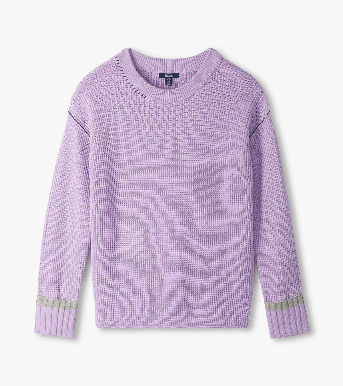 Lilac waffle knit sweater laid flat with crew neck, drop shoulders, and ribbed cuffs with gray stripe