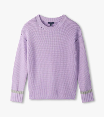 Lilac waffle knit sweater laid flat with crew neck, drop shoulders, and ribbed cuffs with gray stripe