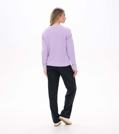 Back view of lilac waffle knit sweater with drop shoulders and ribbed hem and cuffs with gray stripe