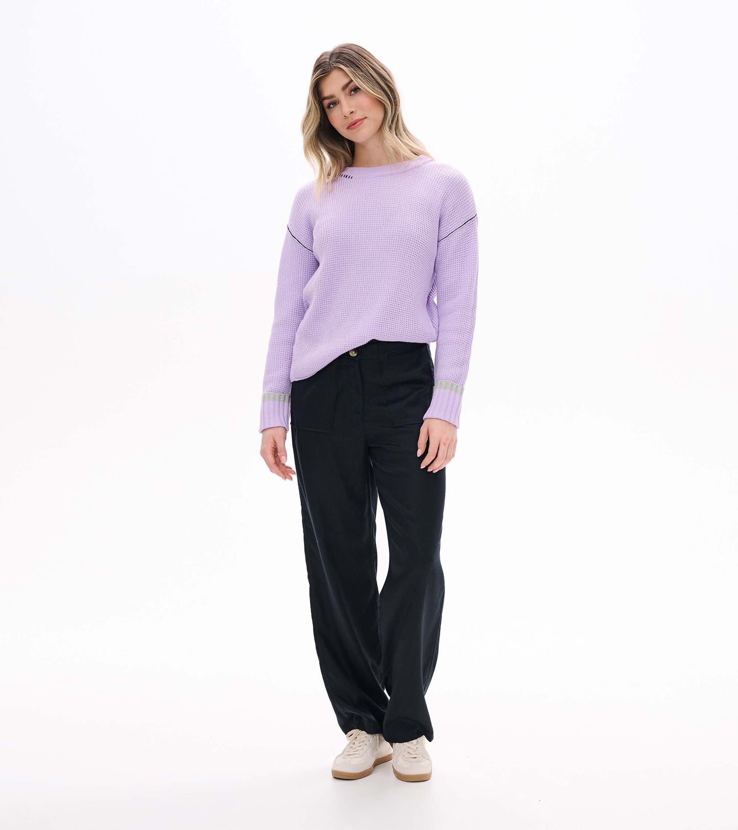 Angled front view of lilac waffle knit sweater with crew neck and ribbed cuffs with gray stripe