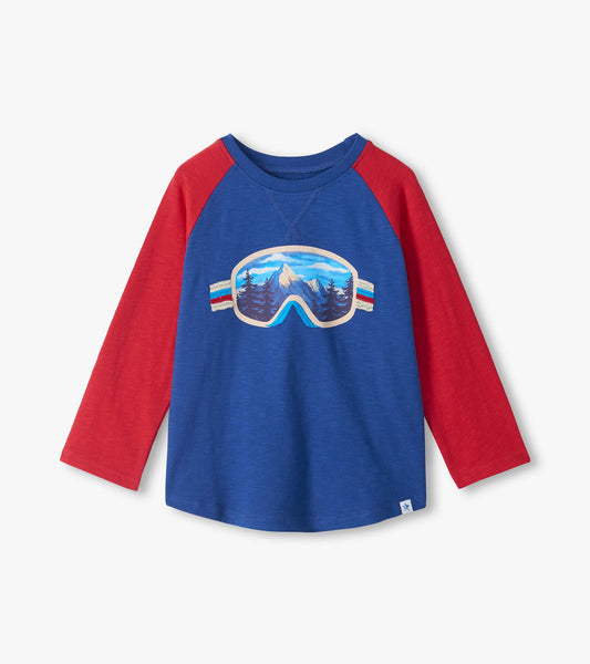 Blue boys raglan T-shirt with red long sleeves and mountain landscape ski goggles graphic on front