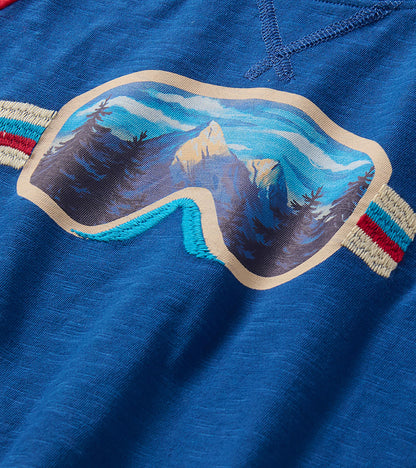 Close-up of mountain landscape ski goggles graphic with trees on blue T-shirt