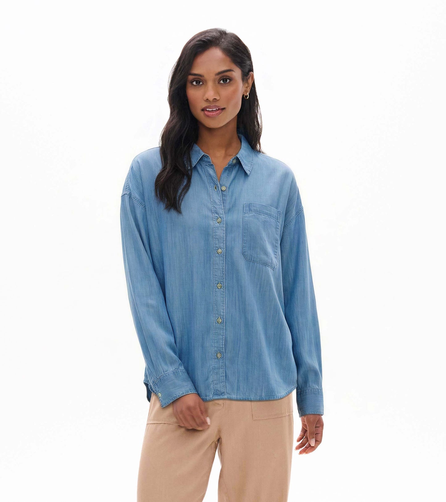 Relaxed light blue wash button-down shirt with collar, chest pocket, and long sleeves, shown on model