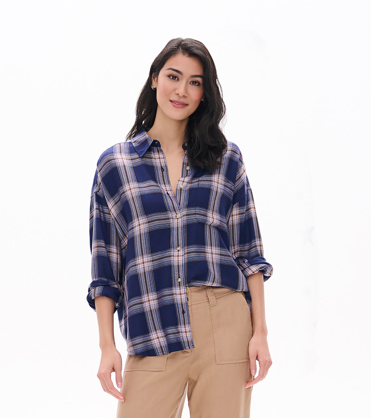 Close front view of relaxed navy plaid button-down shirt with collar, chest pocket, and rolled cuffs