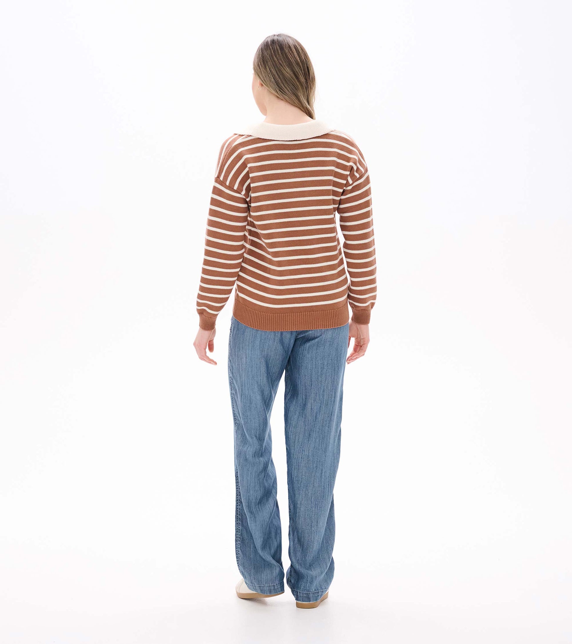 Back view of camel and cream striped Johnny collar sweater with long sleeves and ribbed hem