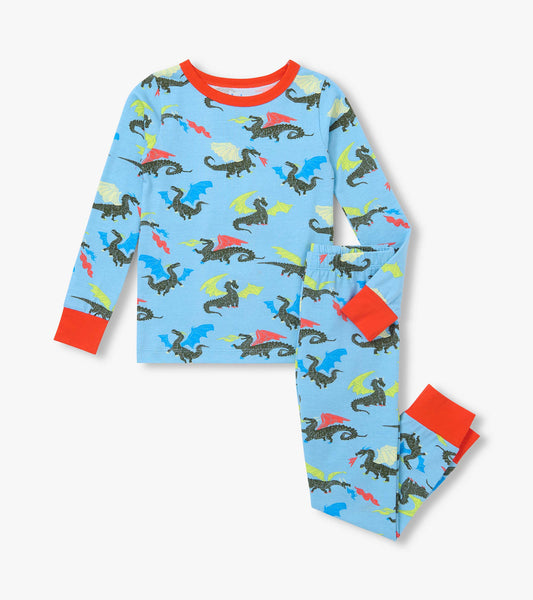 Kids pajama set with blue long-sleeve top and pants, multicolor dragon print, and red cuffs and neckline
