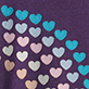 Pattern of small blue, lavender, and white hearts on a dark purple background