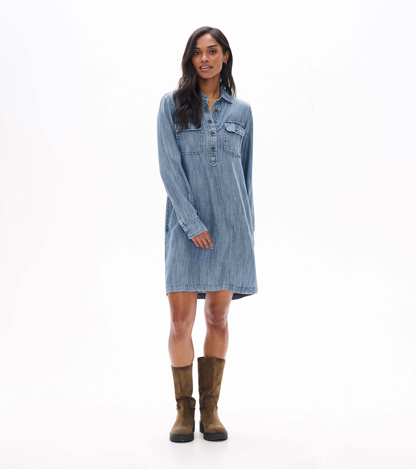 Blue acid rinse popover dress shown from the front with long sleeves, collar, and chest flap pockets