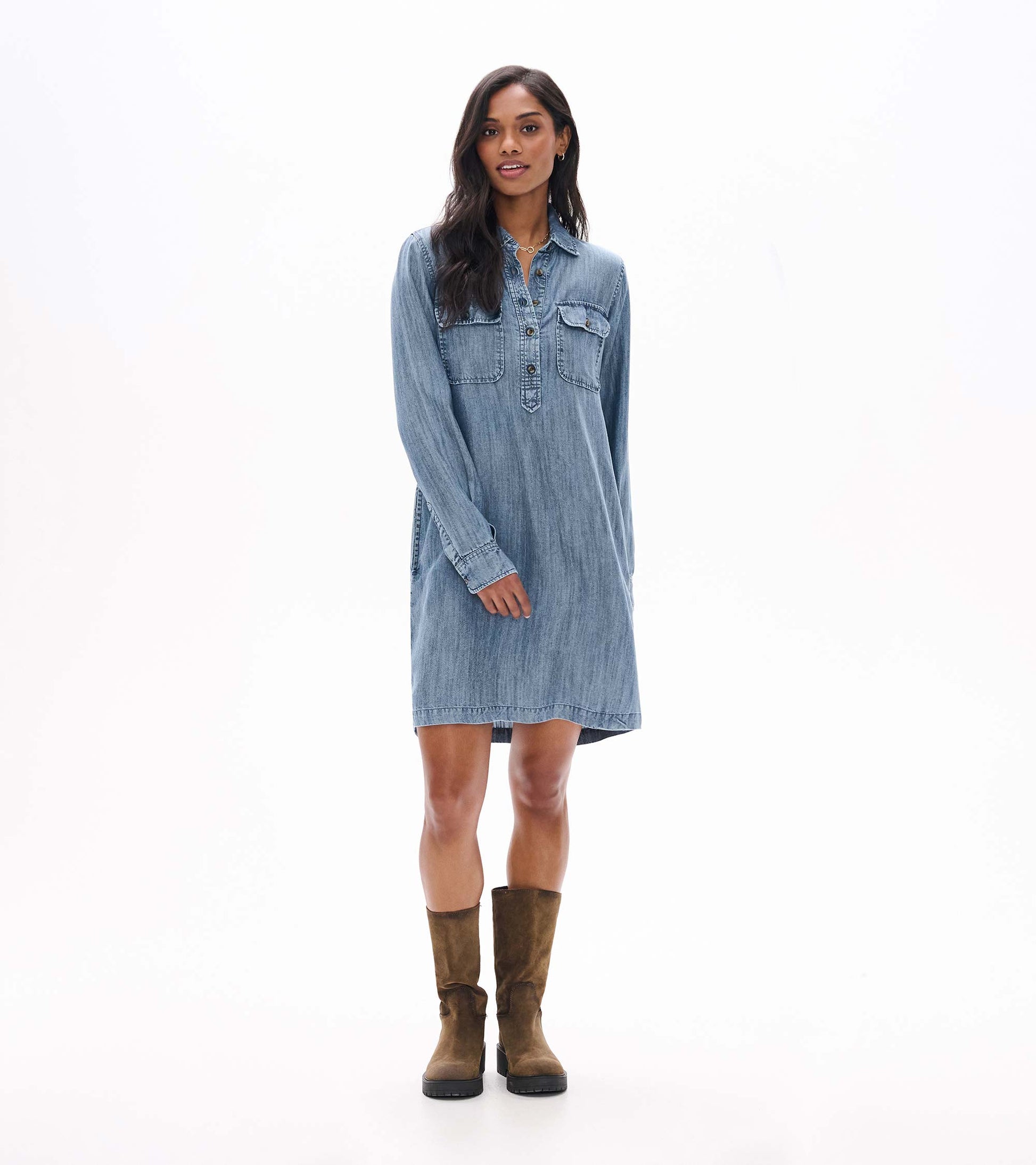 Blue acid rinse popover dress shown from the front with long sleeves, collar, and chest flap pockets