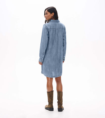 Back view of blue acid rinse popover dress with long sleeves and curved back yoke