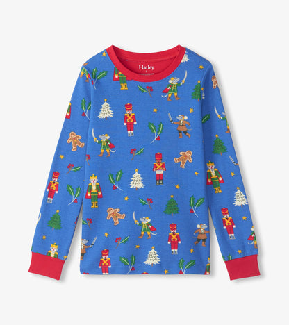 Blue pajama top with red collar and cuffs, printed with nutcrackers, mice, holly and Christmas trees