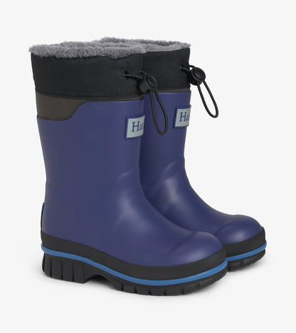 Pair of navy kids rain boots with gray faux-fur trim, black drawcord tops, and chunky black soles