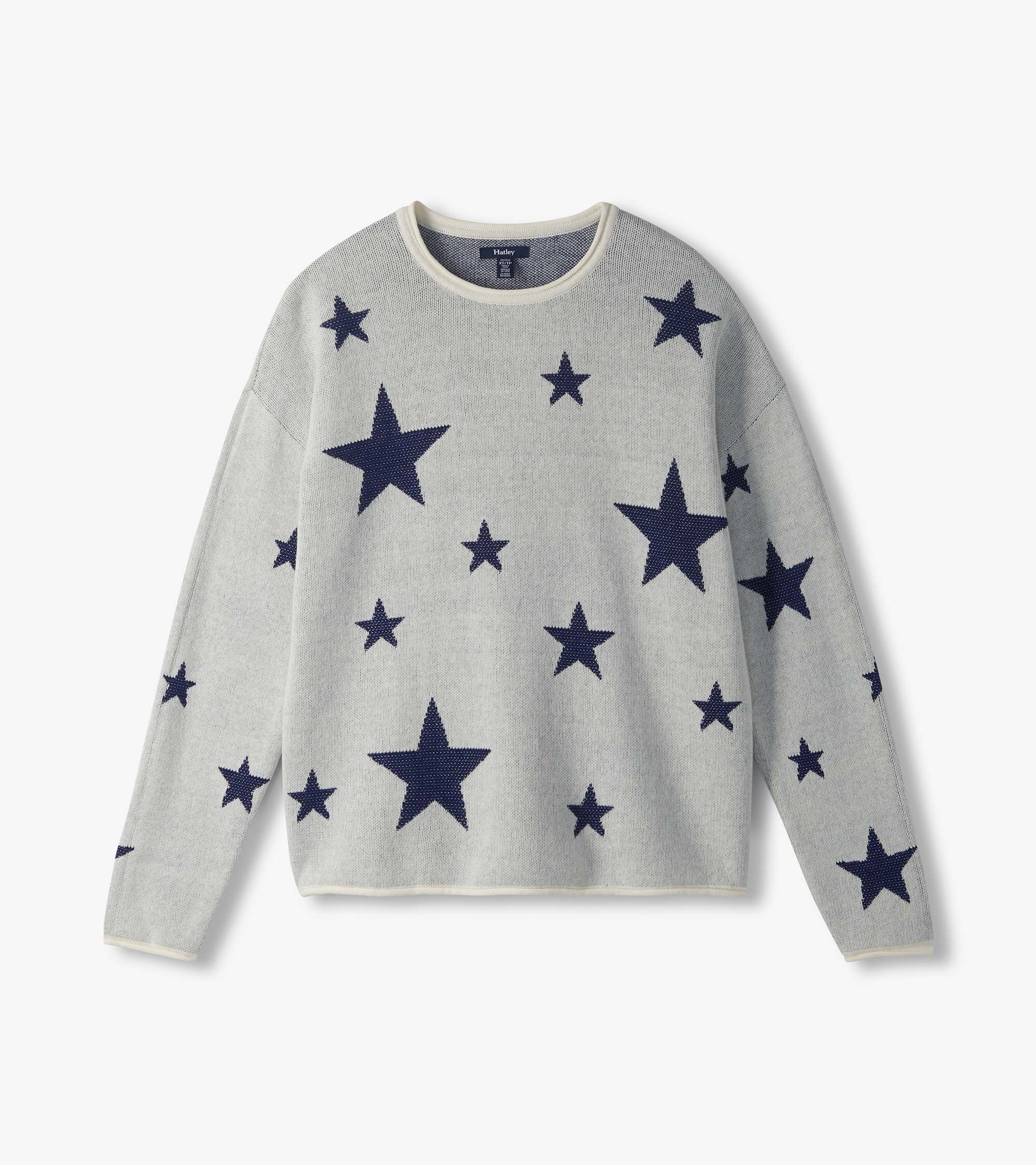 Flat lay front view of cream rolled edge sweater with scattered navy stars