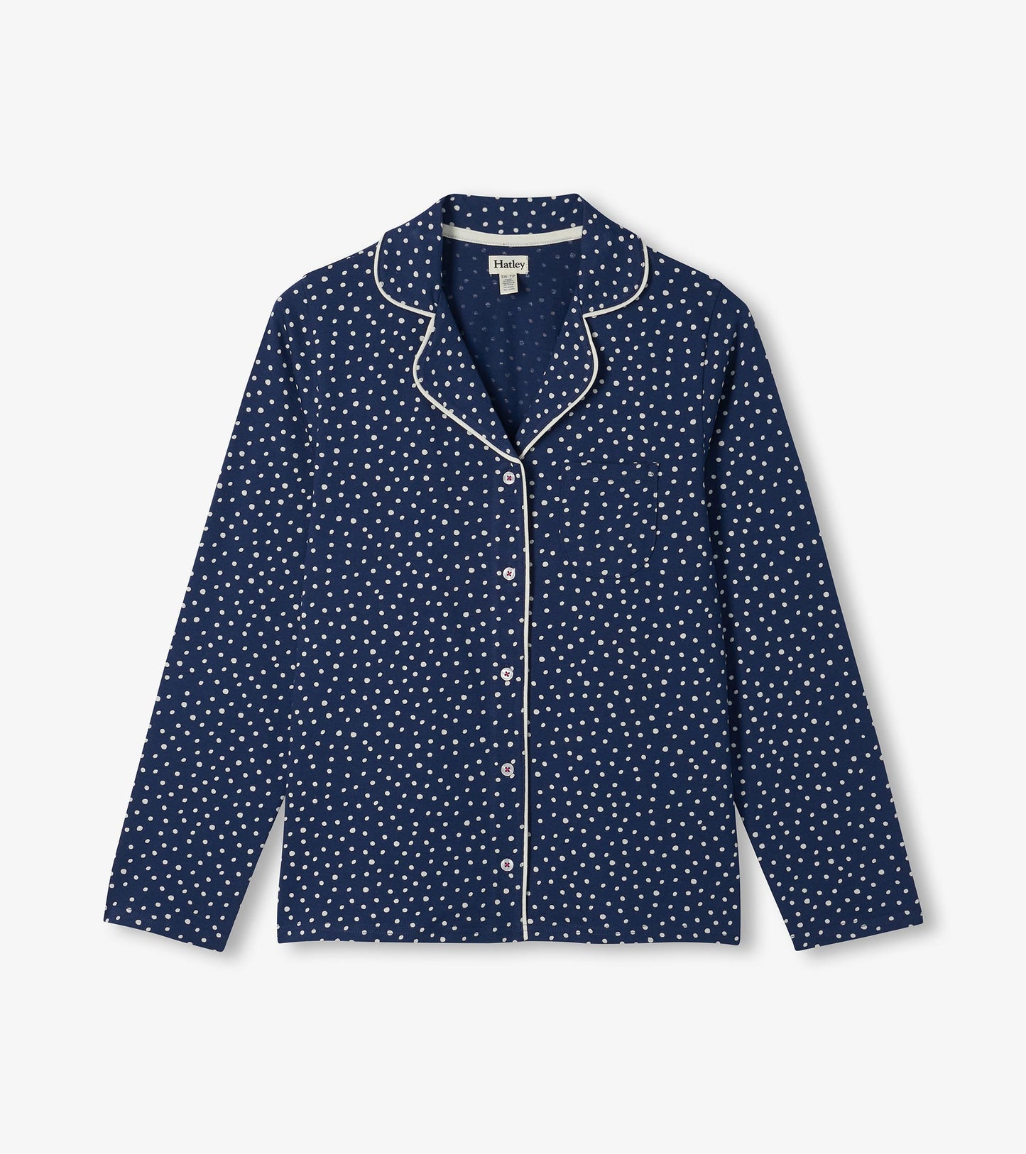 Blue polka dot pajama top with white piping, chest pocket, and button-front long sleeves