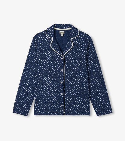 Blue polka dot pajama top with white piping, chest pocket, and button-front long sleeves