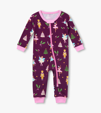 Front view of infant coverall in deep purple with pink trim and zipper, nutcracker, ballerina and tree print