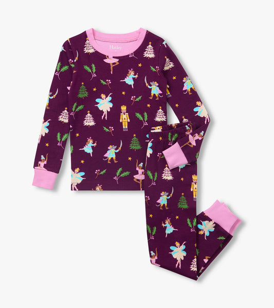 Girls pajama set with purple nutcracker print and pink trim, shown with long-sleeve top and matching pants