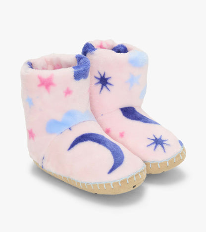 Pair of pink slipper boots with blue moons, stars and clouds, shown from the front