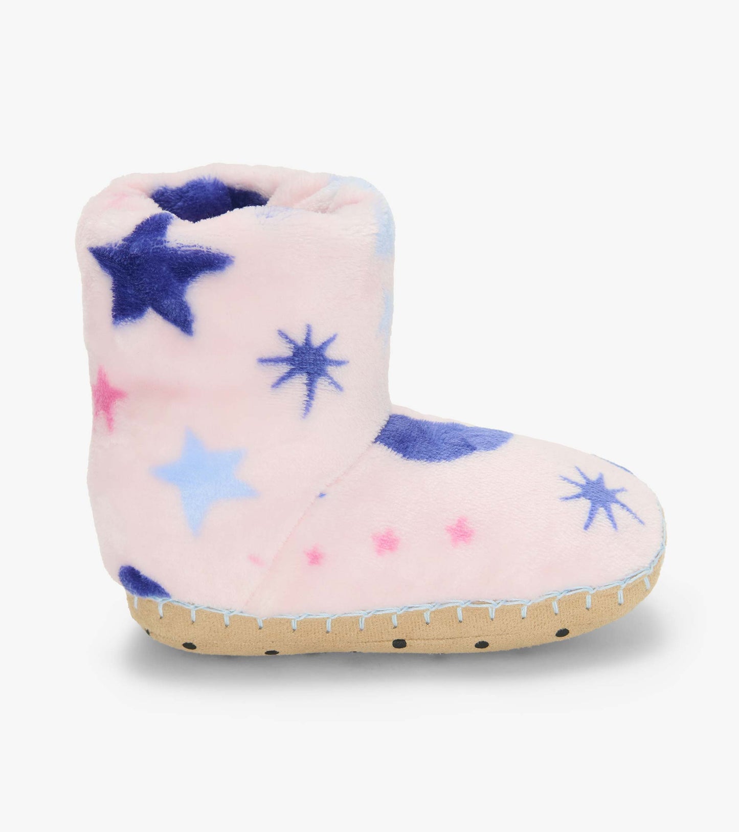 Single pink slipper boot in side view with blue and pink star print and tan sole