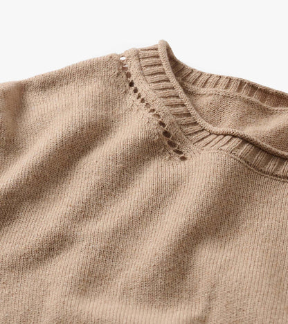Close-up of oatmeal melange crew neck sweater with ribbed collar and open-knit detail at the shoulder