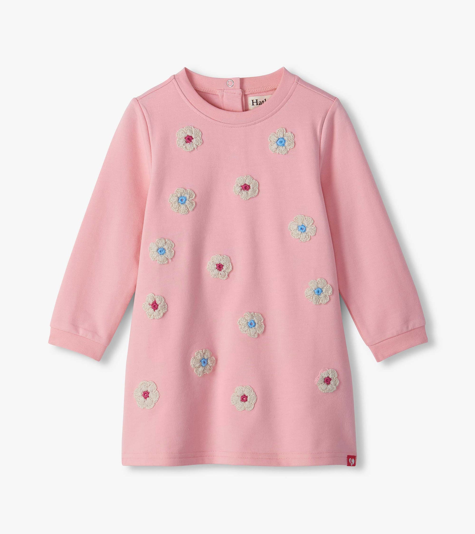 Pink long sleeve infant dress with cream flower appliqués and blue and pink centers