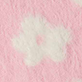 White flower on a pink textured background
