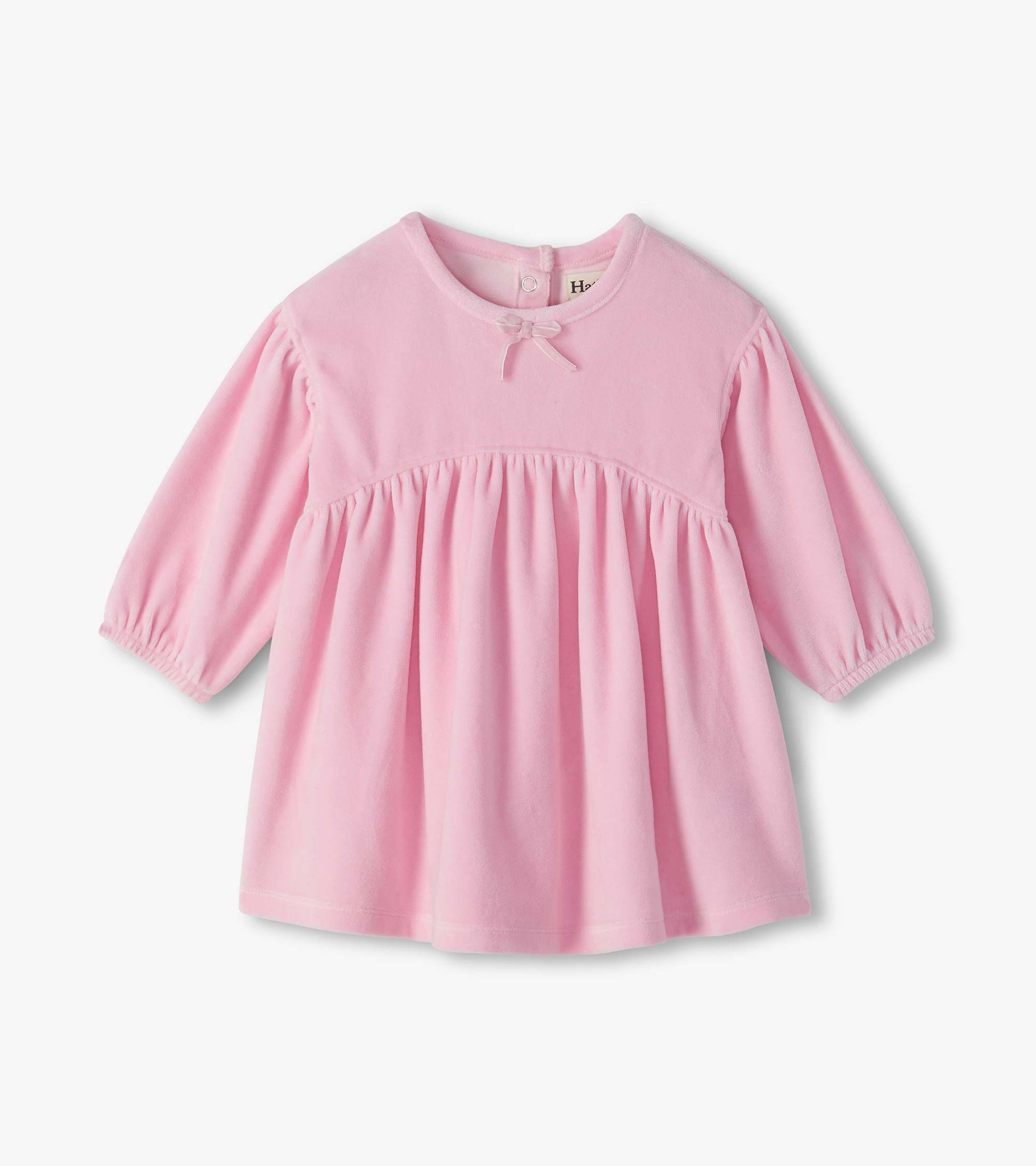 Infant pink long-sleeve dress with a gathered waist, puff sleeves, and small bow at the neckline