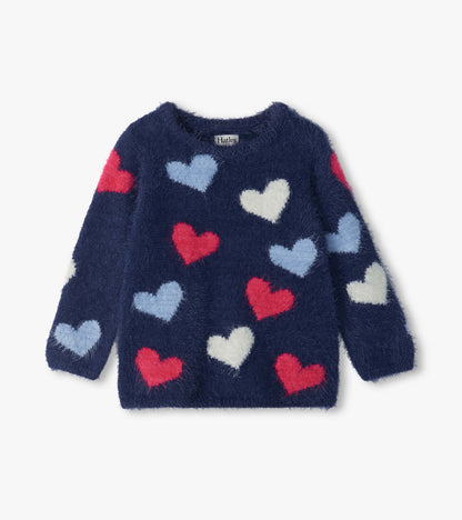 Front view of girls navy sweater with red, light blue, and white heart pattern and round neckline