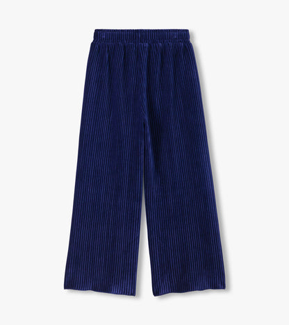 Back view of navy pleated relaxed pants with an elastic waist and wide legs