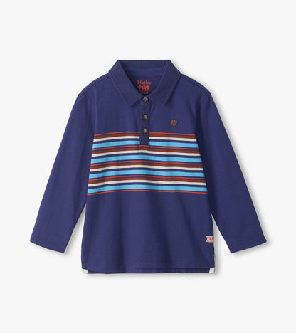 Front view of boys patriot blue rugby shirt with long sleeves, collar, buttons, and multicolor chest stripes
