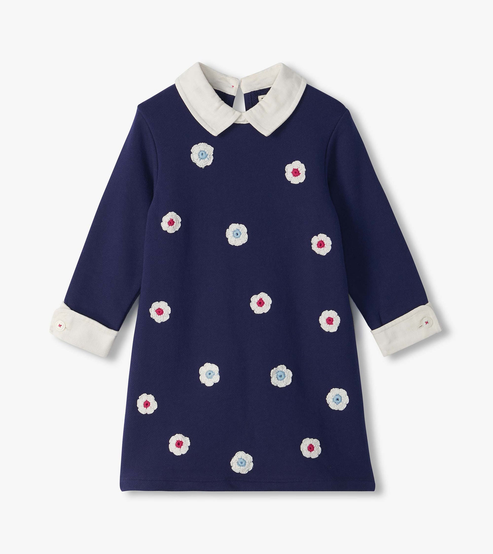 Patriot blue girls dress with white Peter Pan collar, cuffed long sleeves, and scattered flower appliqués